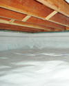 a moisture barrier installed on the walls and floors of a crawl space in Indianola