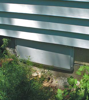 A gray crawl space vent cover in Waukee