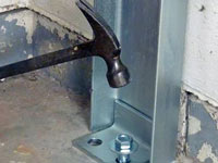 Mounting a foundation channel anchor installation to the floor in Marshalltown.