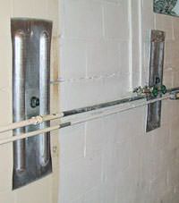 A foundation wall anchor system used to repair a basement wall in Knoxville