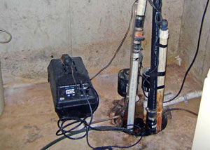 Pedestal sump pump system installed in a home in Clive